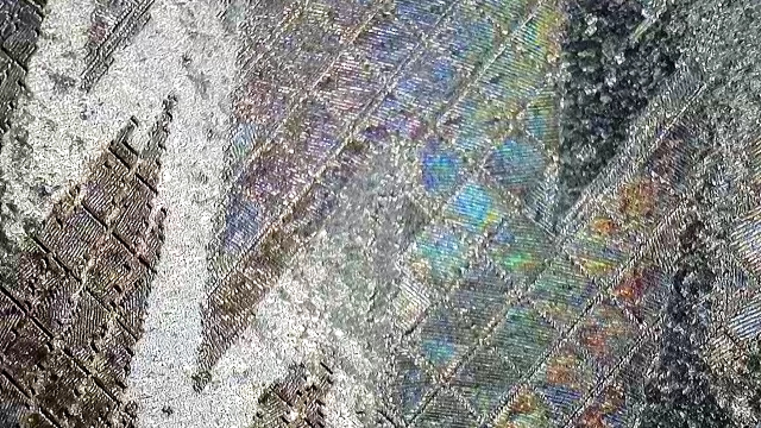 Macro photograph of diffraction engraving patches and changing line directions