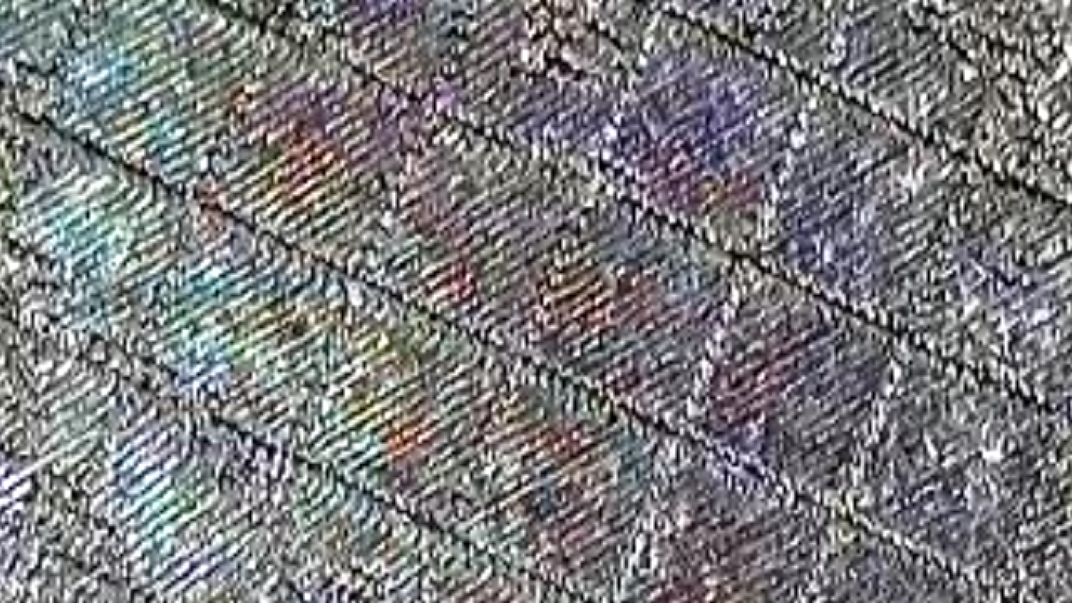 Close view of multiple diffraction regions on stainless steel